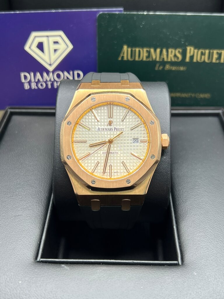 Classic Audemars Piguet watch with gold dial and black belt